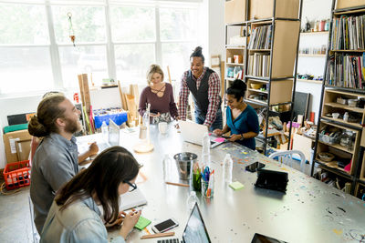 High angle view of business people working at conference table