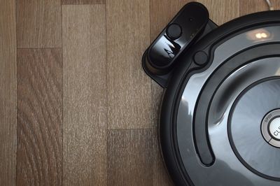 Directly above shot of headphones on wooden table