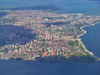 Aerial view of sea and buildings in city