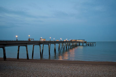 Pier over sea against sky