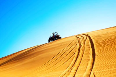 View of desert against clear sky