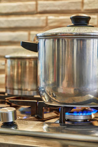 Several pots of cooking food on the gas stove at home in the kitchen. home cooking concept