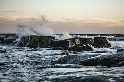 View of waves breaking at sea