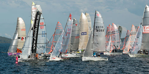 Panoramic view of people sailing on sea against sky