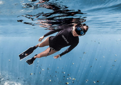 Woman swimming in sea