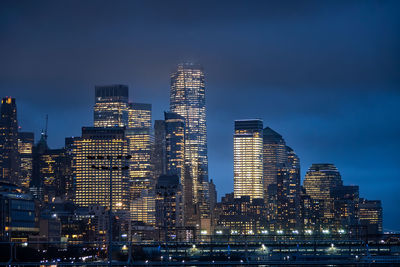 Illuminated buildings in city at night