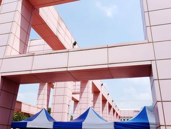 Low angle view of modern buildings against sky