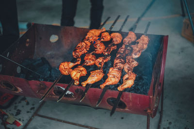 High angle view of meat on barbecue grill