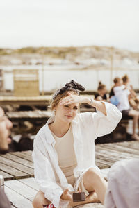 Young woman sitting outdoors