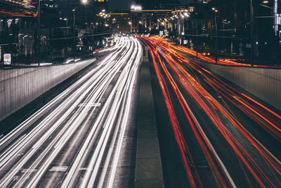 High angle view of light trails on highway at night