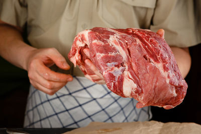 Midsection of person preparing food