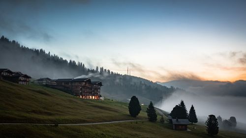 Built structure on mountain during sunset