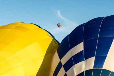 Low angle view of hot air balloon against blue sky