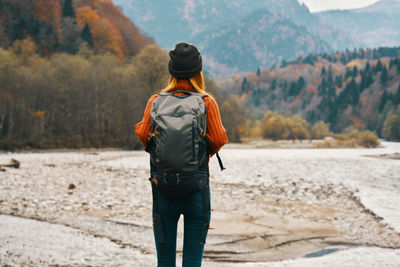 Rear view of man looking at mountains