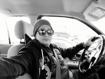 Portrait of boy sitting in car