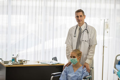 Portrait of doctor with patient in hospital