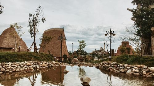 Panoramic view of lake and rocks against sky