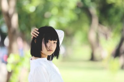 Portrait of woman standing outdoors