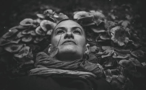 High angle view of thoughtful lying on leaves