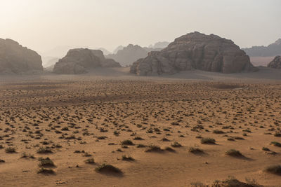 Rock formations at desert against sky