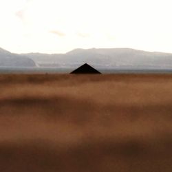 House on landscape against sky