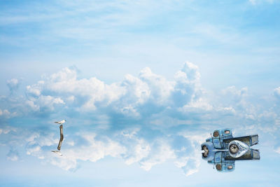 Low angle view of airplane flying against sky