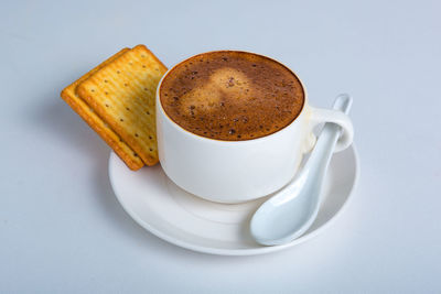 Close-up of coffee cup on table