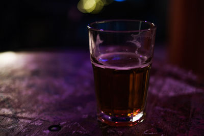 Close-up of beer glass on table