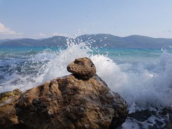 Waves splashing on rocks at shore