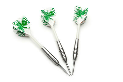 High angle view of darts on white background