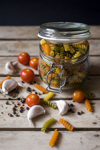 Close-up of fruits in glass jar on table