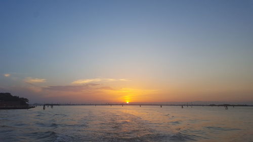 Scenic view of sea against sky at sunset