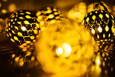 Close-up of illuminated christmas lights on table