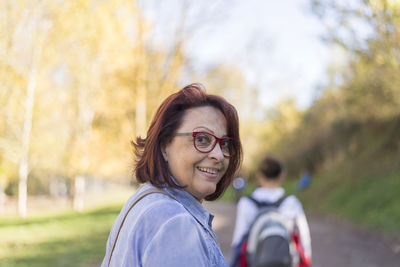 Portrait of smiling woman on field