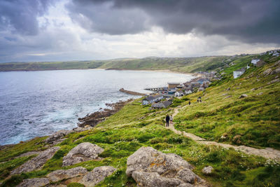 View of sennen cove in cornwall, uk as storm clouds roll in.