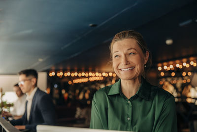 Happy mature businesswoman at hotel lounge