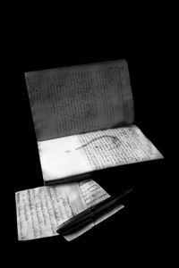 High angle view of pen on table against black background