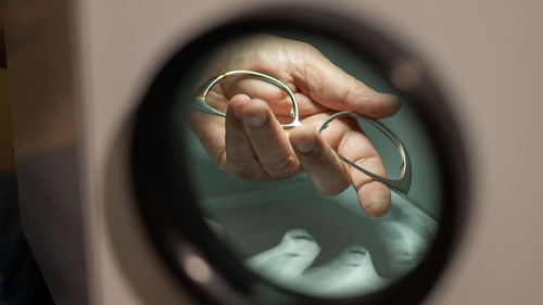 Close-up of hand holding glass
