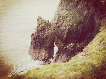 View of rock formation by sea