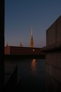 Illuminated buildings against sky