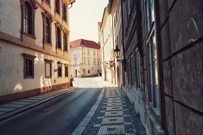 Narrow alley along buildings