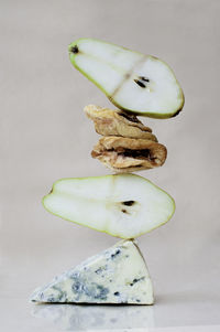 Close-up of fruits on table against white background