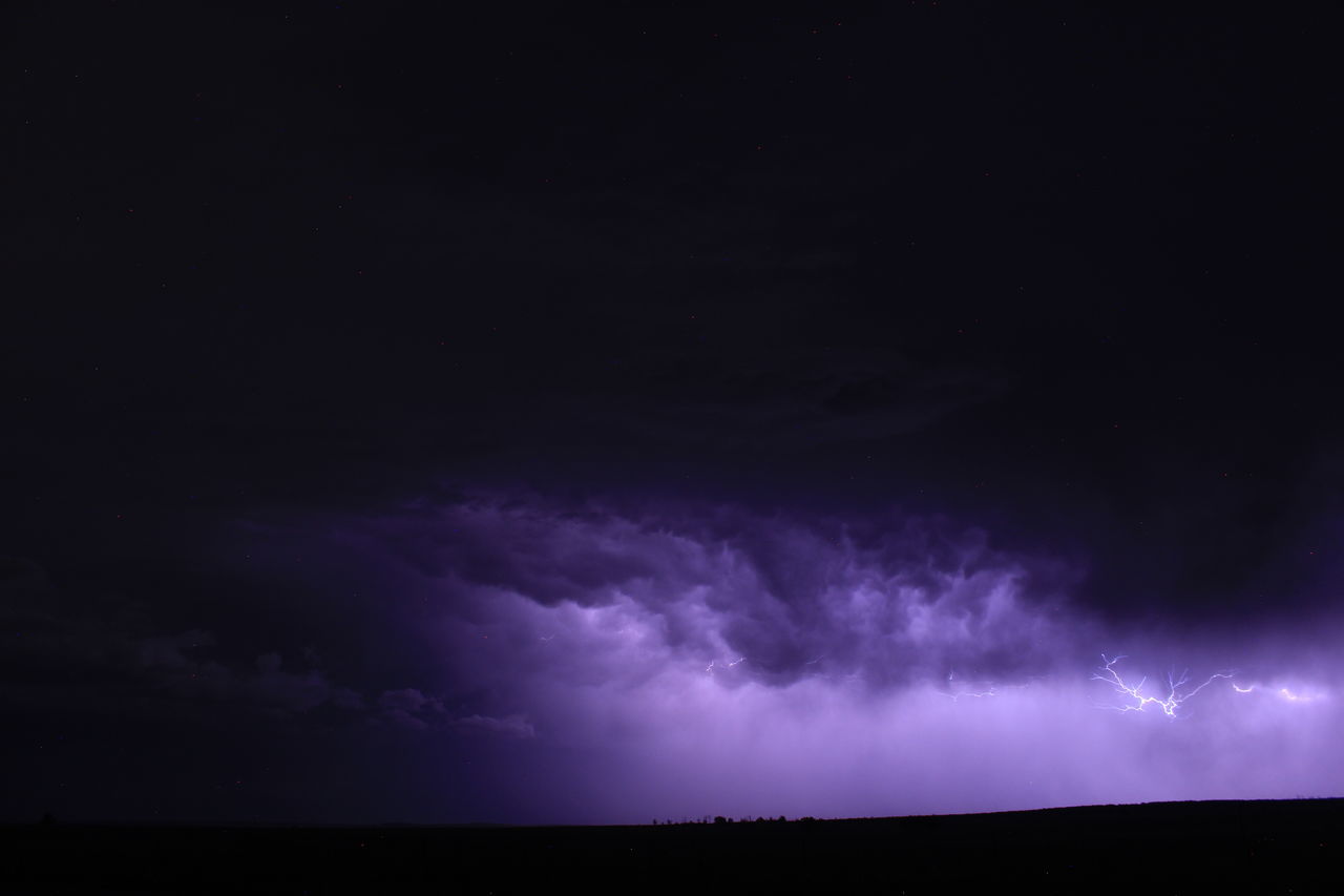 storm, thunderstorm, power in nature, lightning, thunder, night, cloud, beauty in nature, sky, environment, purple, storm cloud, warning sign, darkness, dark, dramatic sky, nature, no people, scenics - nature, sign, copy space, communication, forked lightning, outdoors, awe, landscape, horizon