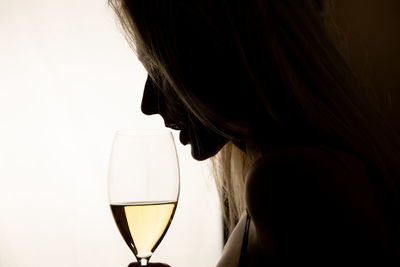 Close-up of woman holding wineglass