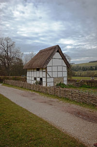 House on field against sky