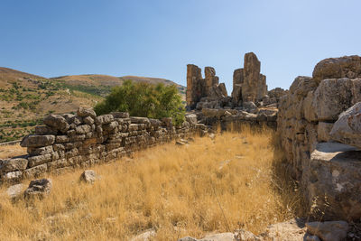 Panoramic view of old ruins against clear sky
