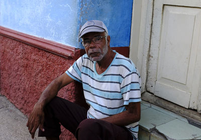 Portrait of man sitting outdoors