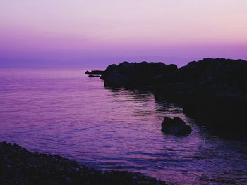 Scenic view of sea against sky at sunset