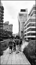 High angle view of woman walking on footpath