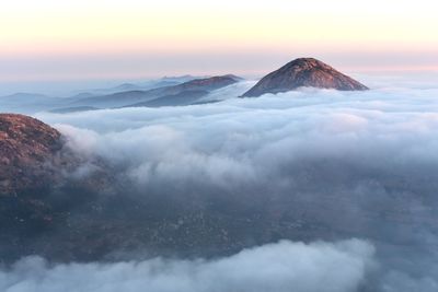 Scenic view of snowcapped mountains against sky during sunset